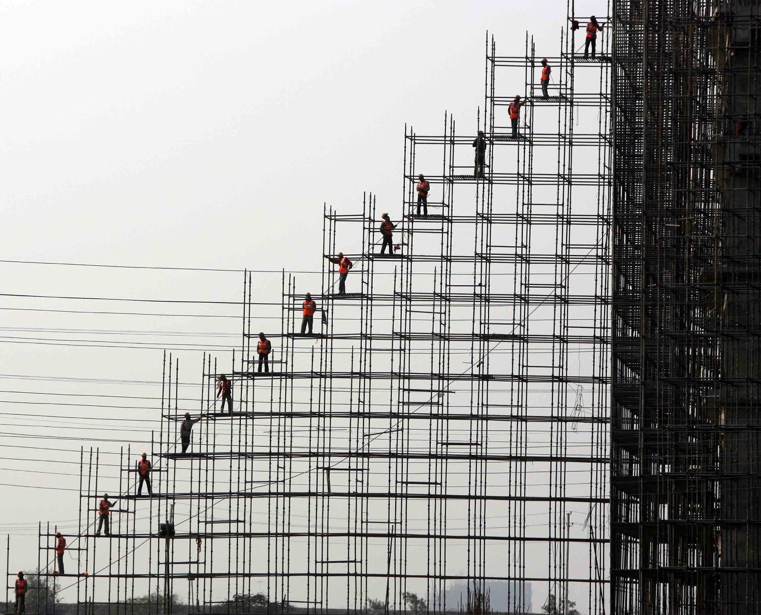 Indian labourers busy in construction of a new mall in Gurgaon, south of New Delhi, India, January 31, 2008.  Indian buyers now have variety to choose from with the opening of new Malls, where its growing consumerism meets growing prosperity.  (UPI Photo)